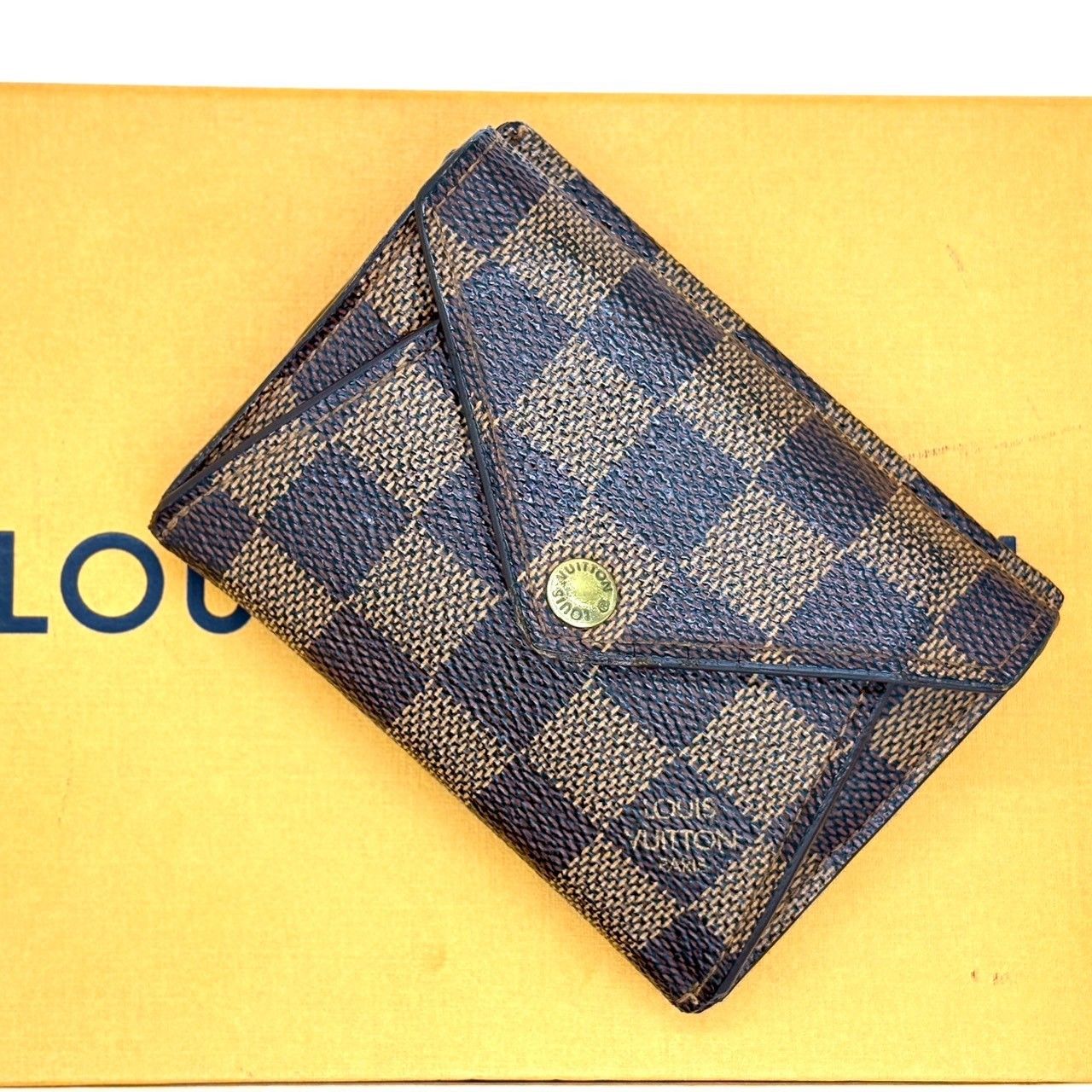 知性を映す上質な定番】 LOUIS VUITTON ルイヴィトン 二つ折り財布