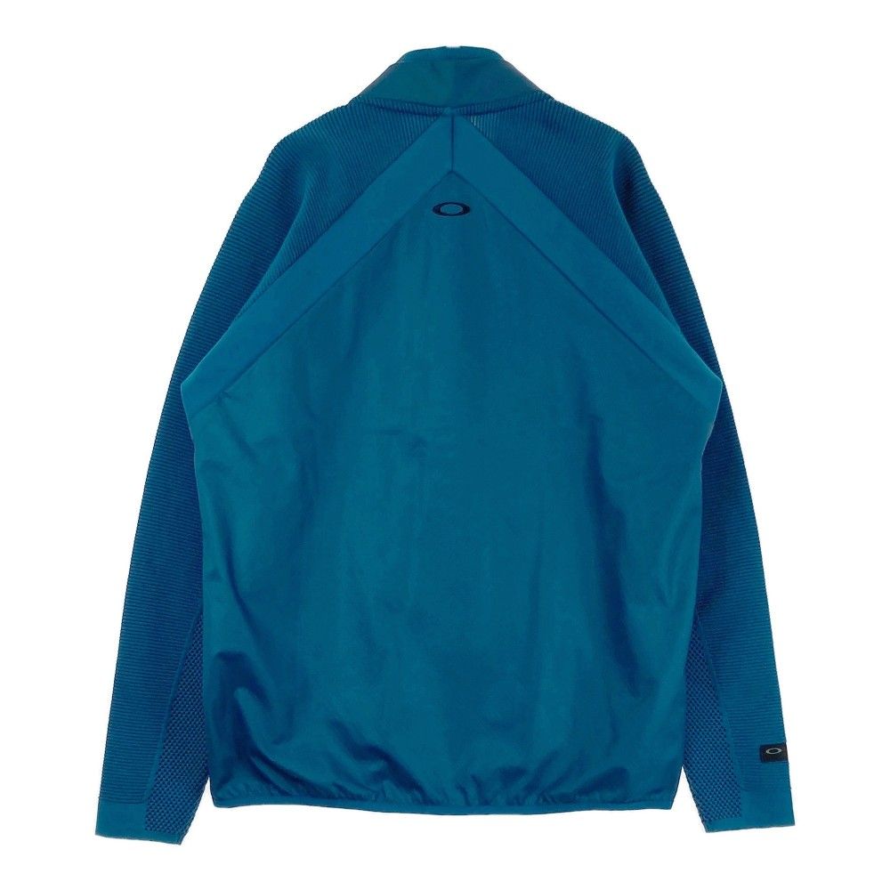 サイズ：XL OAKLEY オークリー  切替ジャケット  ブルー系 [240101435453] ゴルフウェア メンズ ストスト サイズ：XL OAKLEY オークリー 切替 ジップジャケット 総柄
