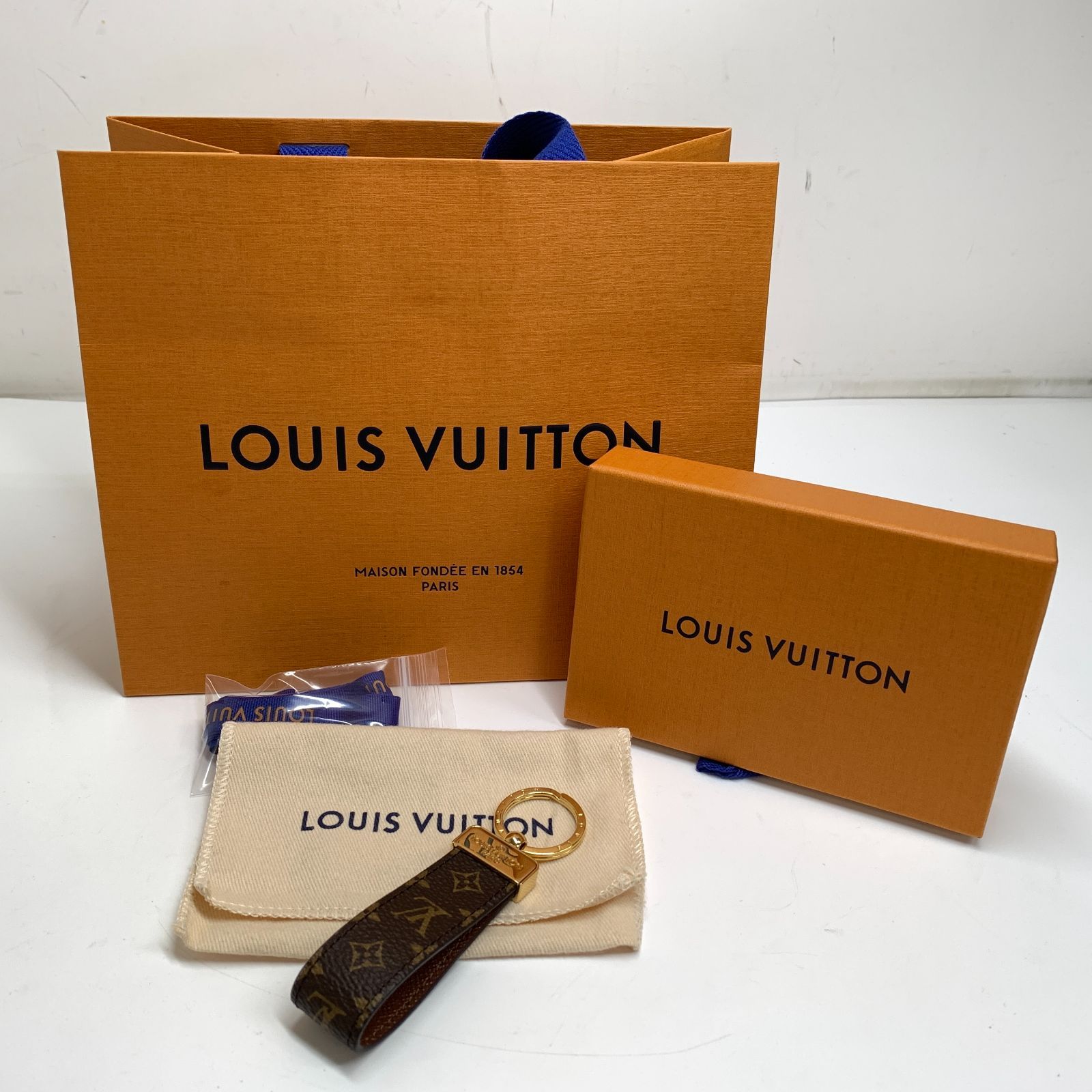 f001 B LOUIS VUITTON ルイヴィトン モノグラム ポルトクレ ドラゴンヌ キーパーリング キーホルダー ブラウン M65221