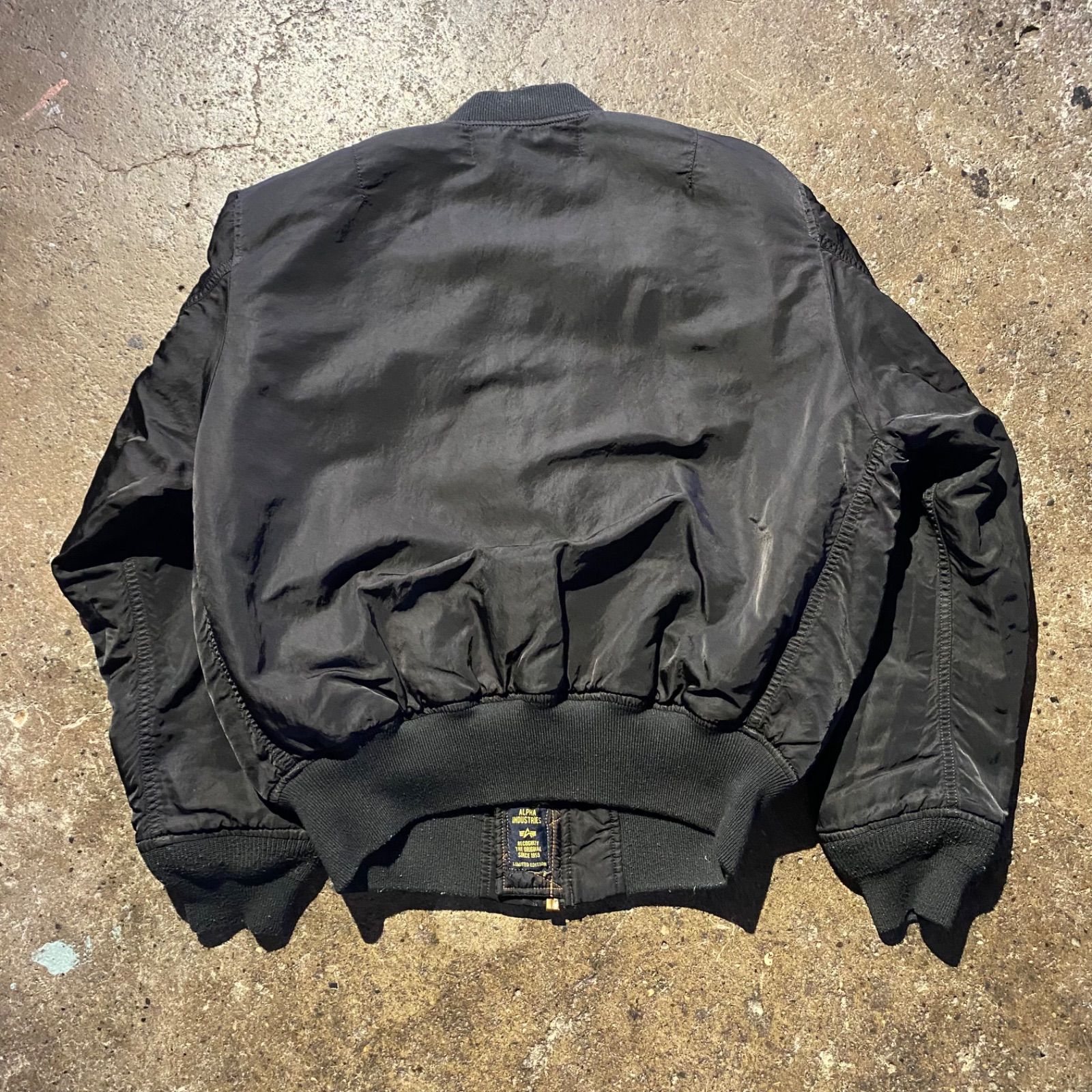 COMME des GARCONS black market × ALPHA ロゴパッチ MA-1 ジャケット