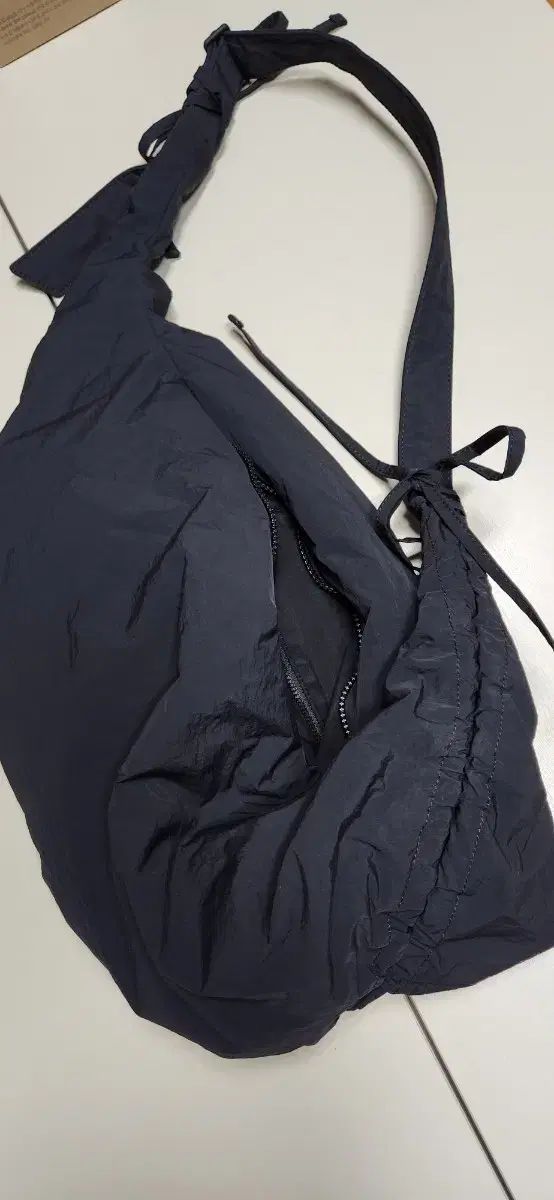 コスシャーリング ボディバッグ