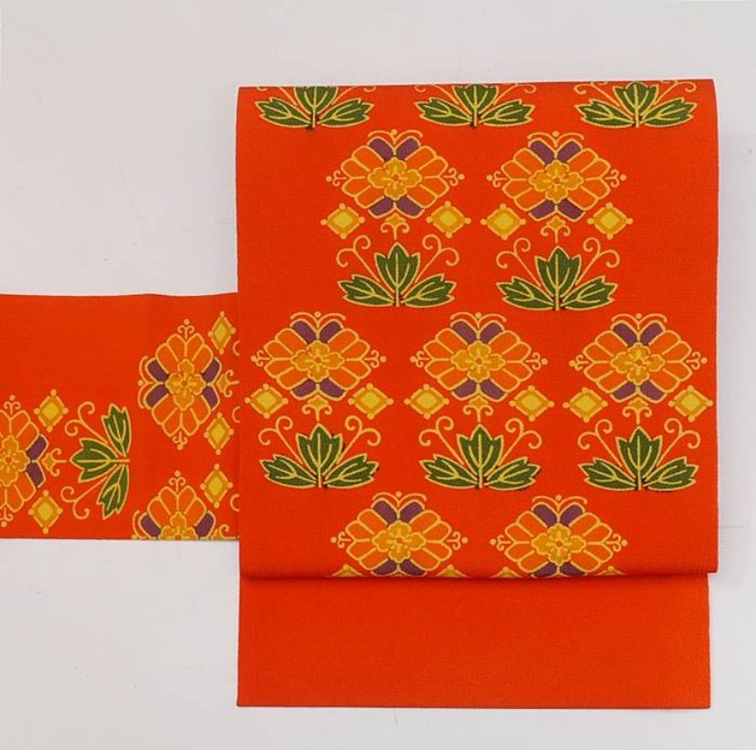 紅型 名古屋帯 紅型染名古屋帯 縮緬地 赤橙色 全通柄染め名古屋帯 紅型染の名古屋帯