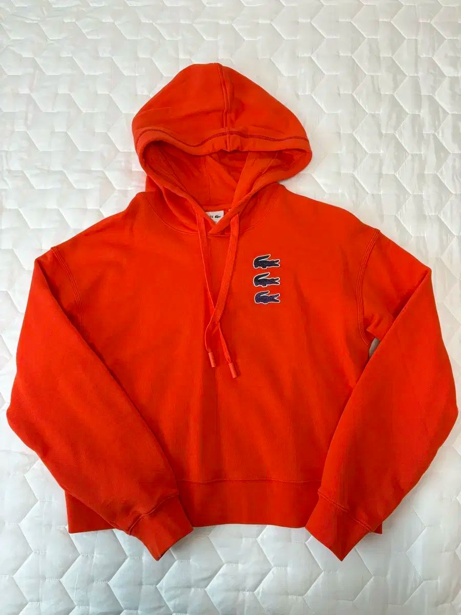 ラコステ オレンジ フードTシャツ