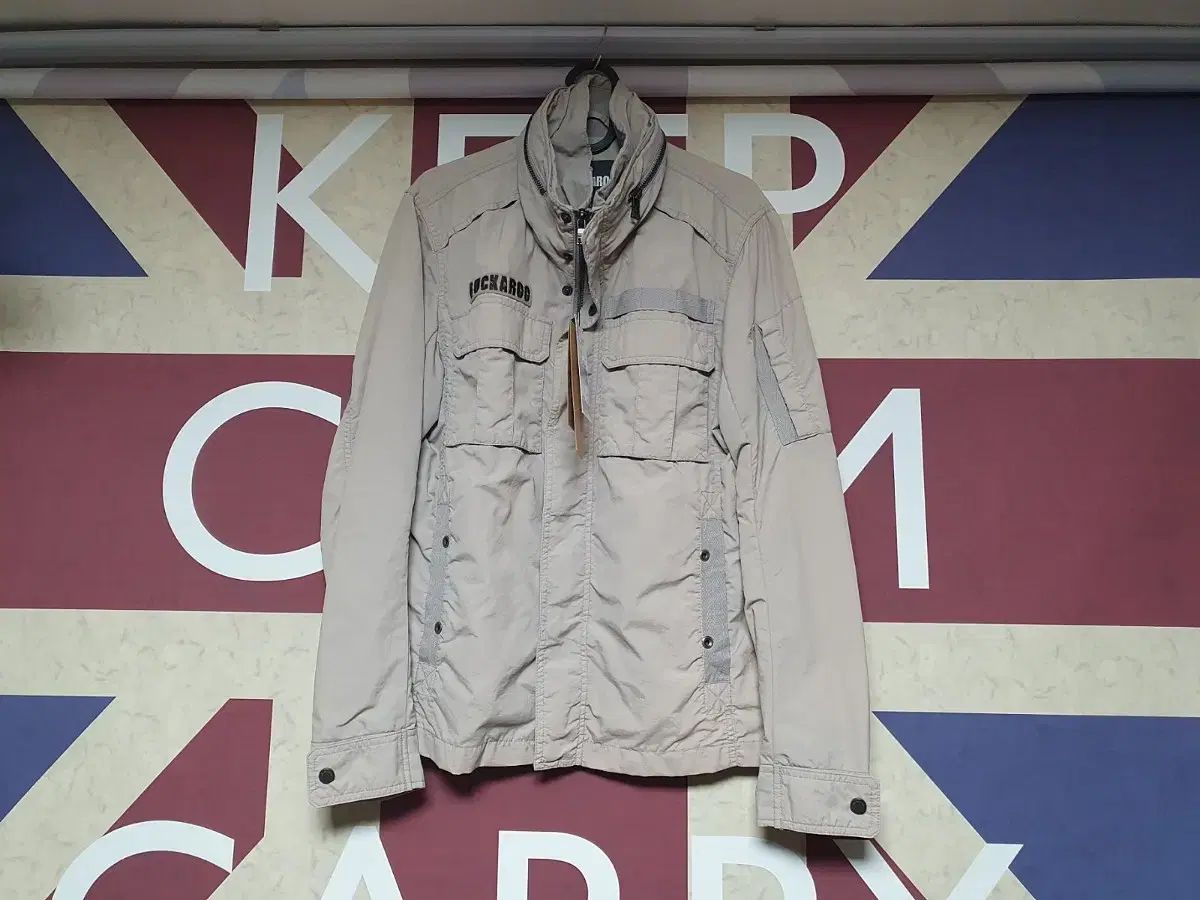 バックル バックポケット装飾 ハイネック ジャンパー ジャケット M 95 サイズ ライト グレー