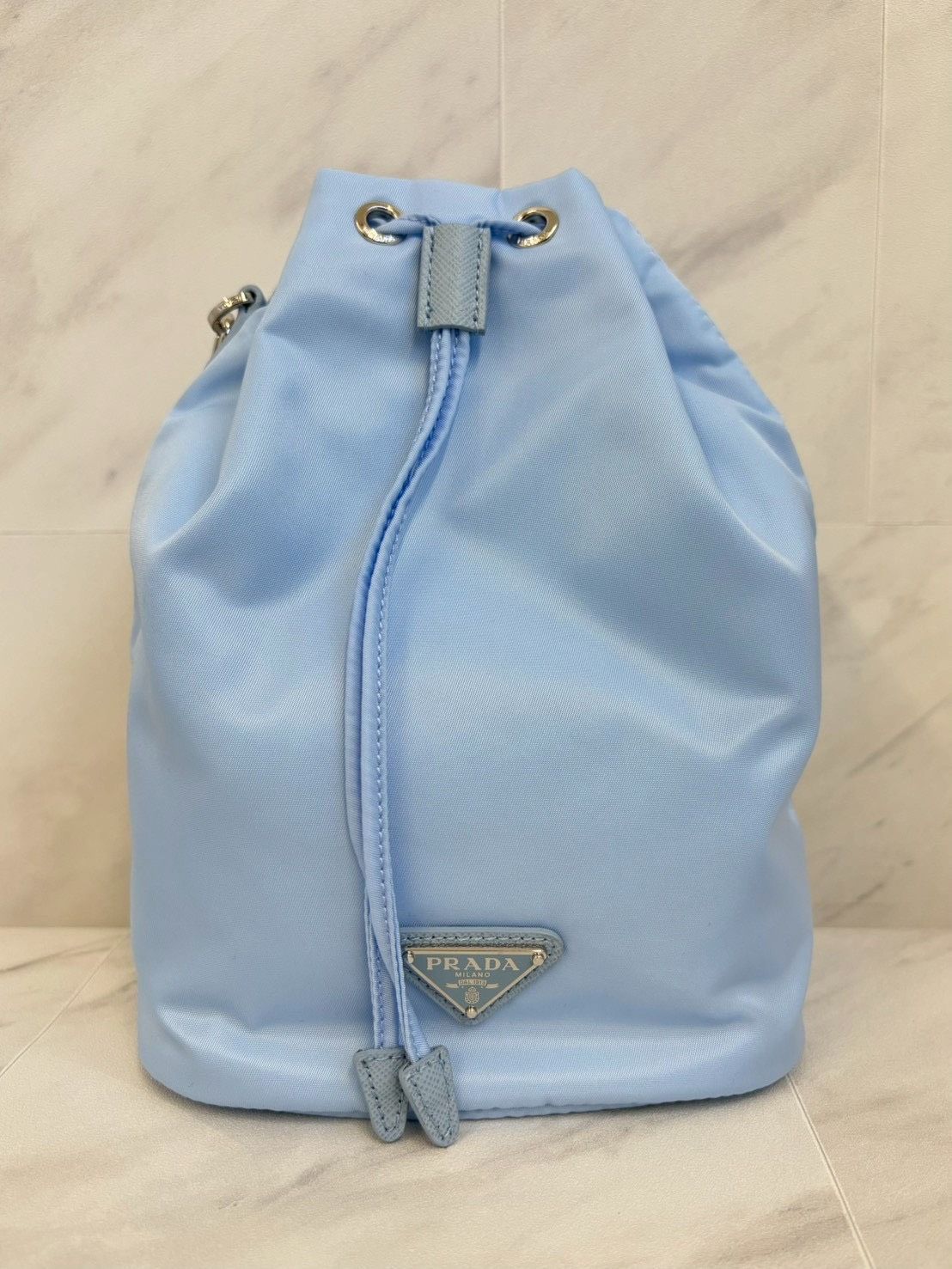 PRADA プラダ 巾着 袋 ミニ ポーチ ストラップ付 Nylon ナイロン 水色 青 ブルー トライアングル ロゴ ワッペン メンズ レディース 小物