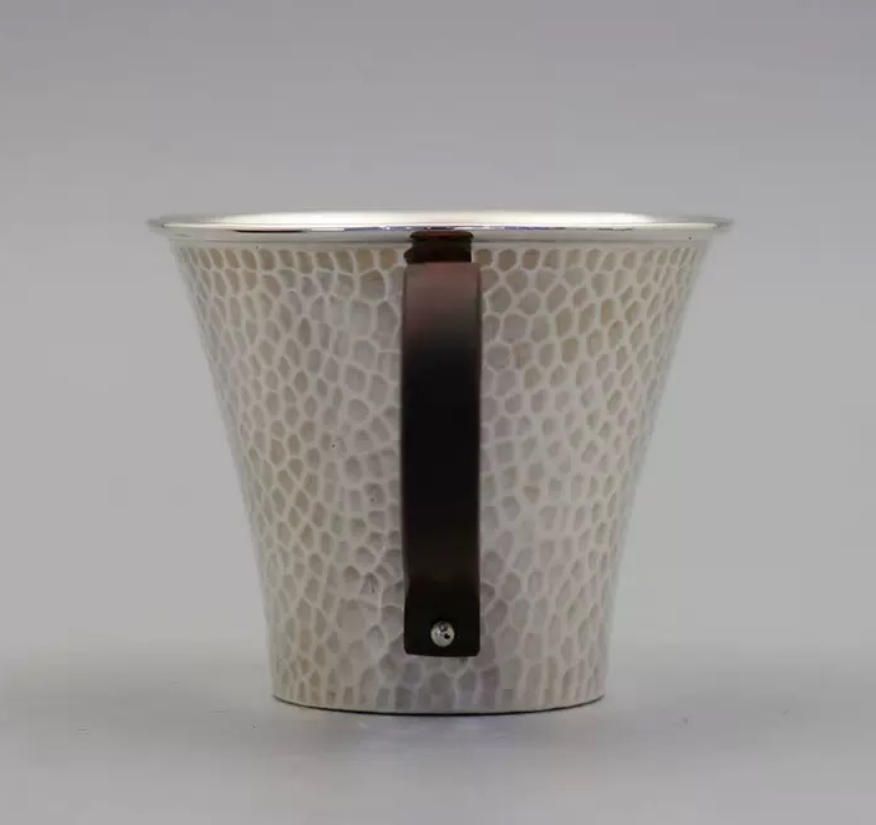 999 の足銀のシンプルなティーカップは シンプルに古い光沢のあるハンマー柄のティーカップを作る