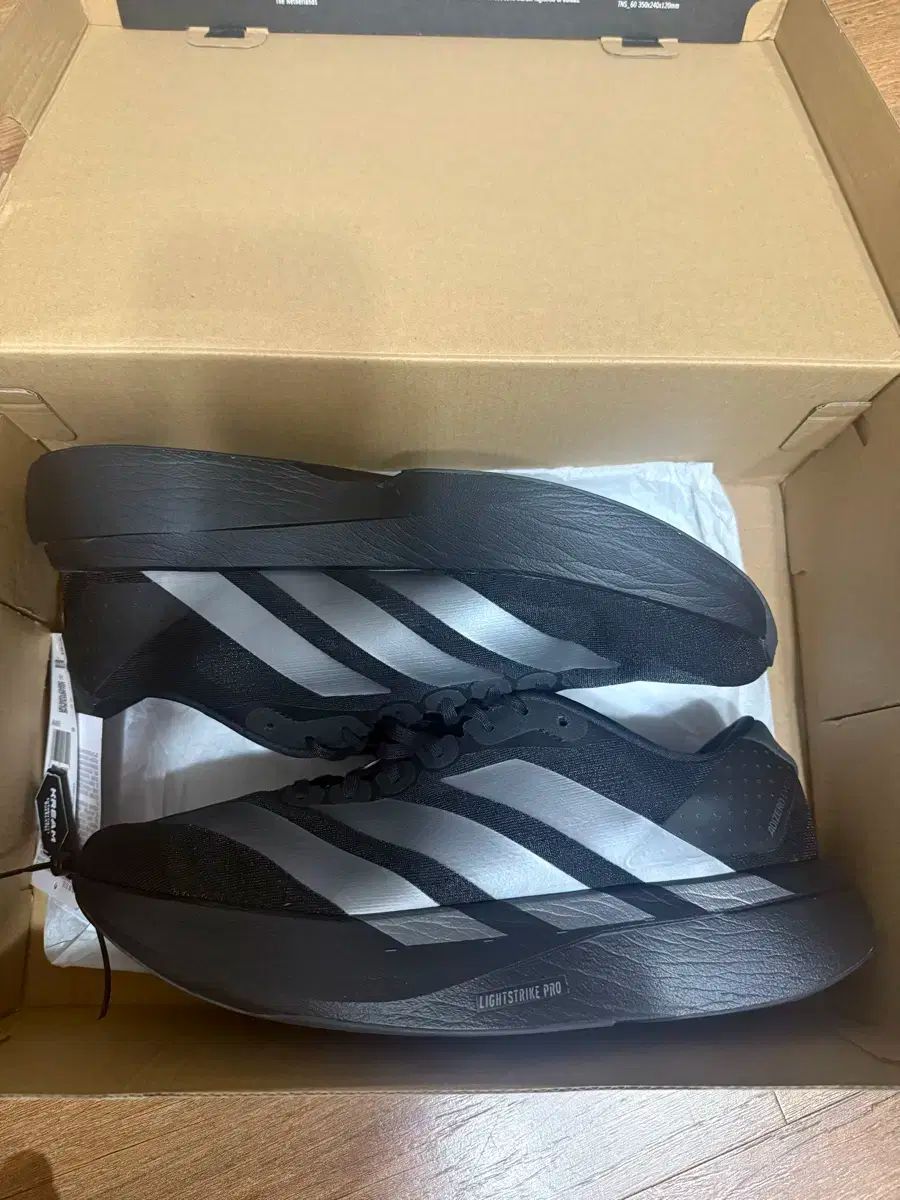 アディゼロ エボ SL コアブラック 285