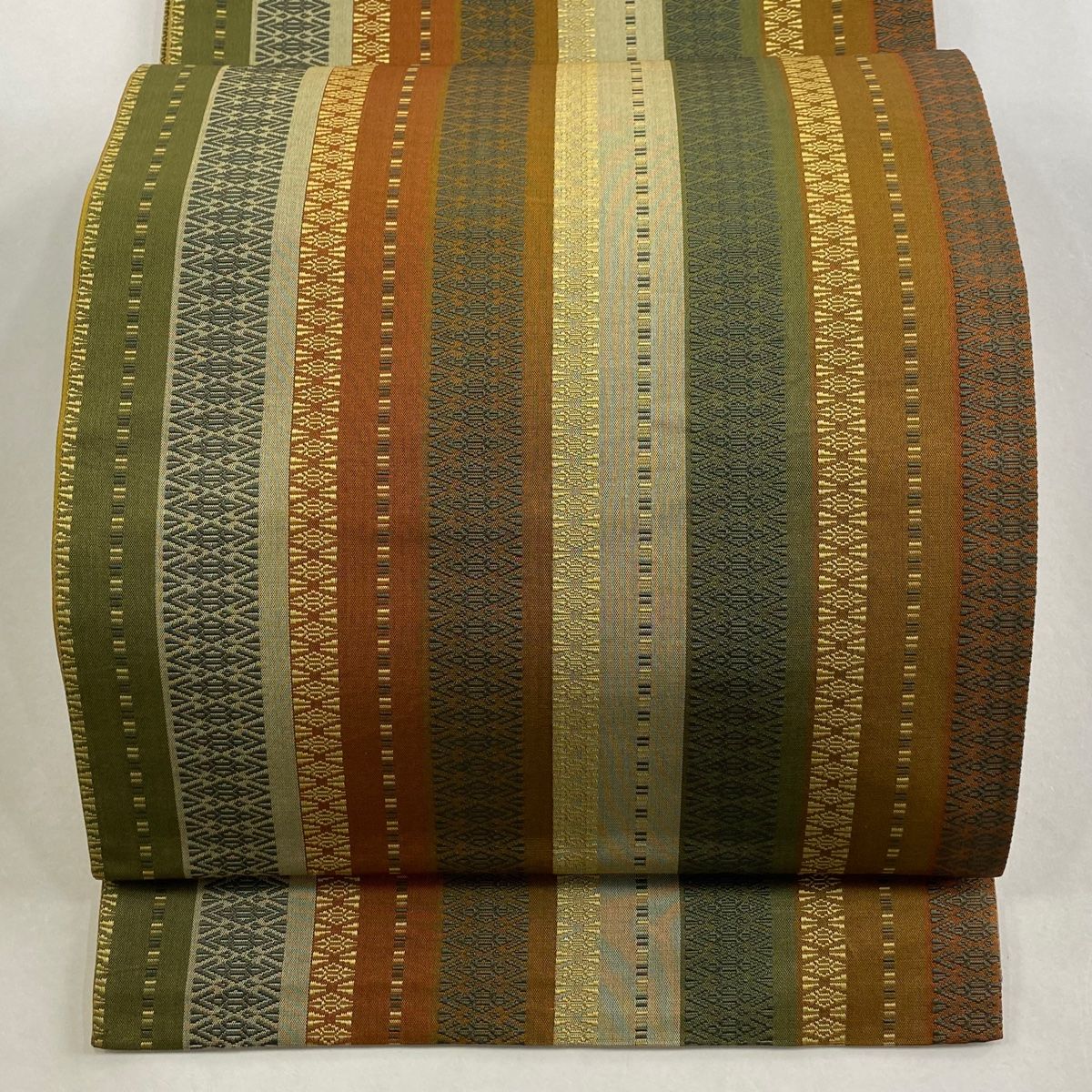 袋帯 秀品 紬地 縞 幾何学模様 茶色 全通 正絹