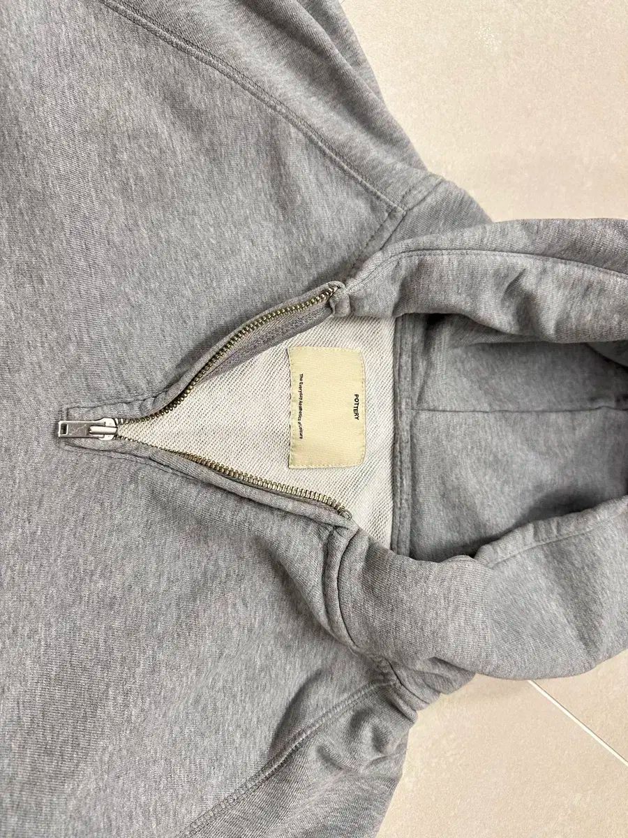 ポッタリー ハーフジップアップ フーディー 2 サイズ