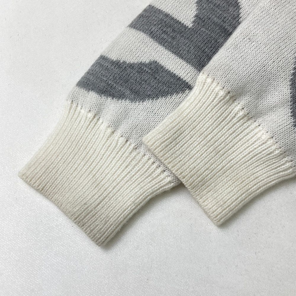 クアルトユナイテッド　スマイリーフェイス セーター・スカートセットアップ クアルトユナイテッド スマイリーフェイス セーター・スカート