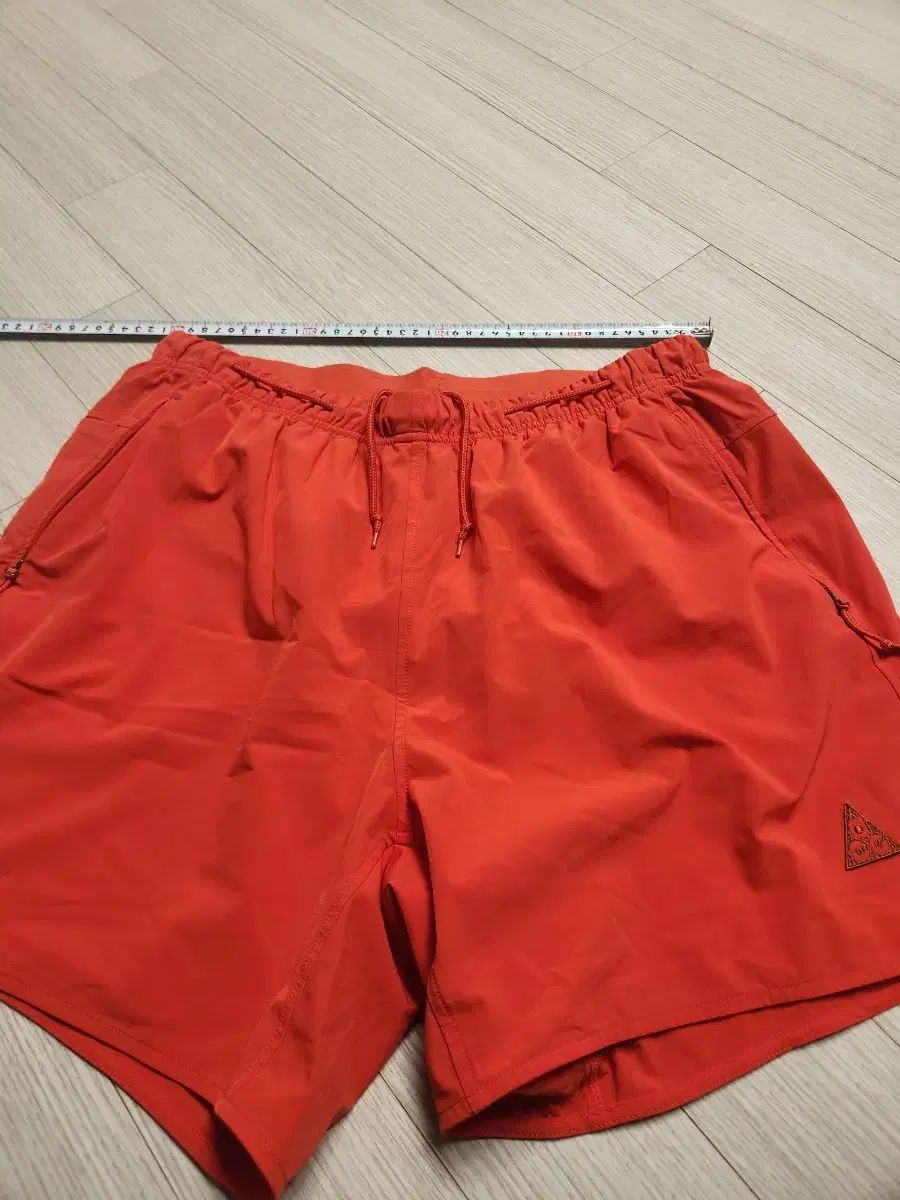 ナイキ ACG オレンジ ハーフパンツ