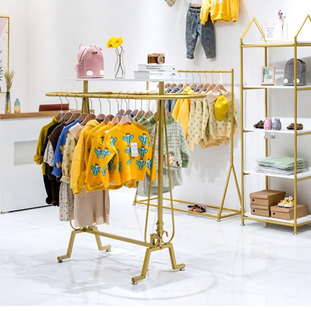丸型衣類ラック 楕円形鉄製衣類吊り下げラック 小売用衣類ラック 寝室用衣類吊り下げ用ポータブル小売ディスプレイスタンド