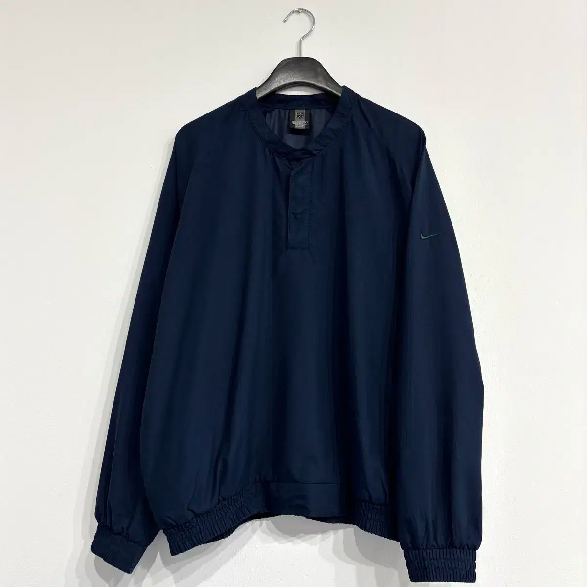 ナイキ 半ボタン ポリエステルシェル ウォームアップ
