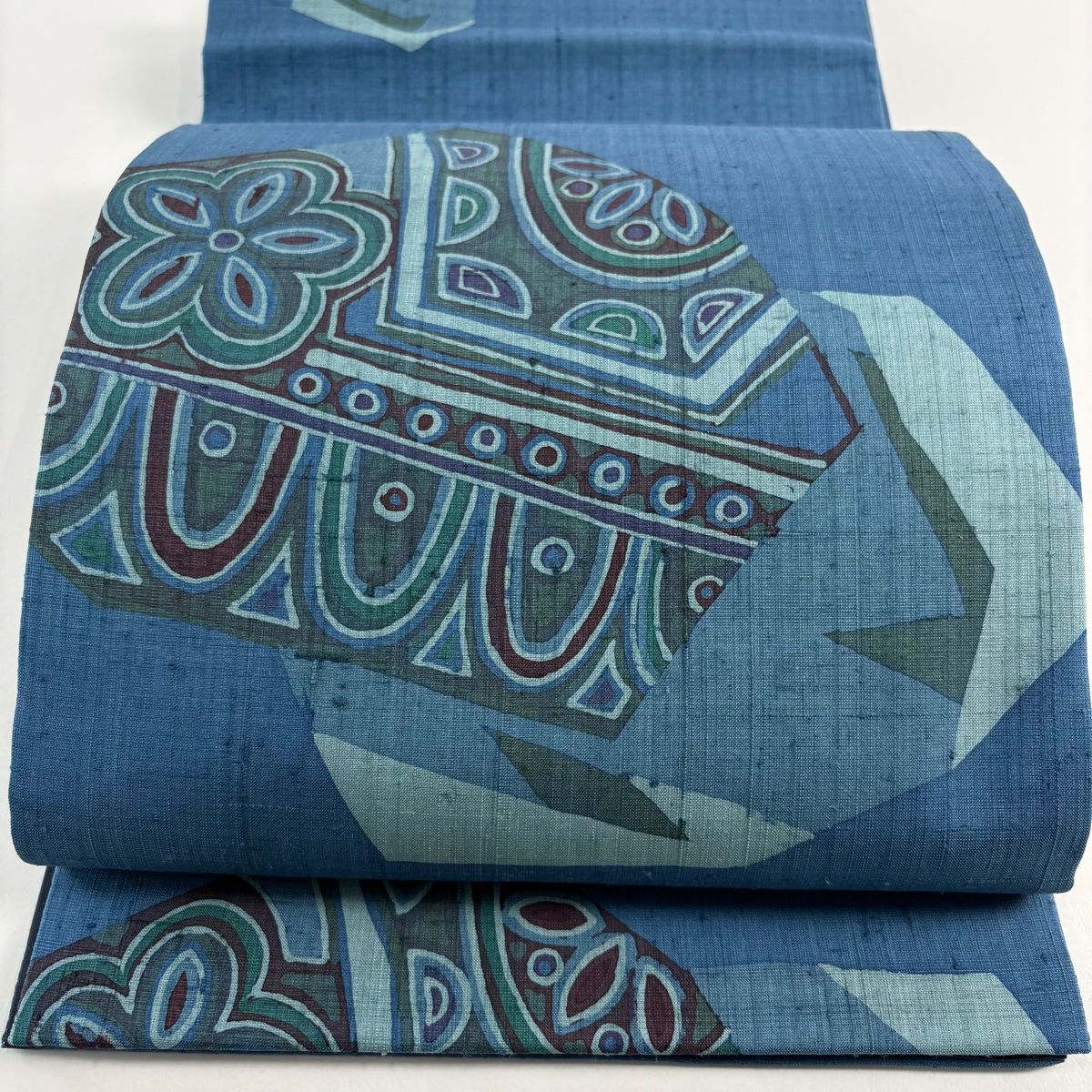 袋帯 秀品 落款 紬地 九代目又司 花 幾何学 藍色 お太鼓柄 正絹