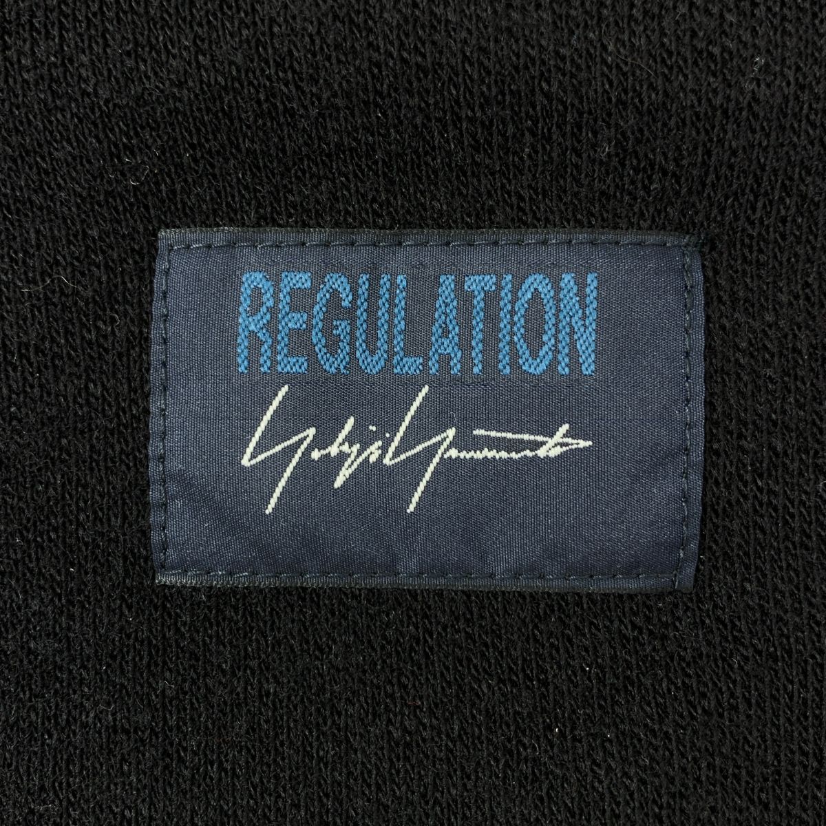 バックフ クルーネックニット