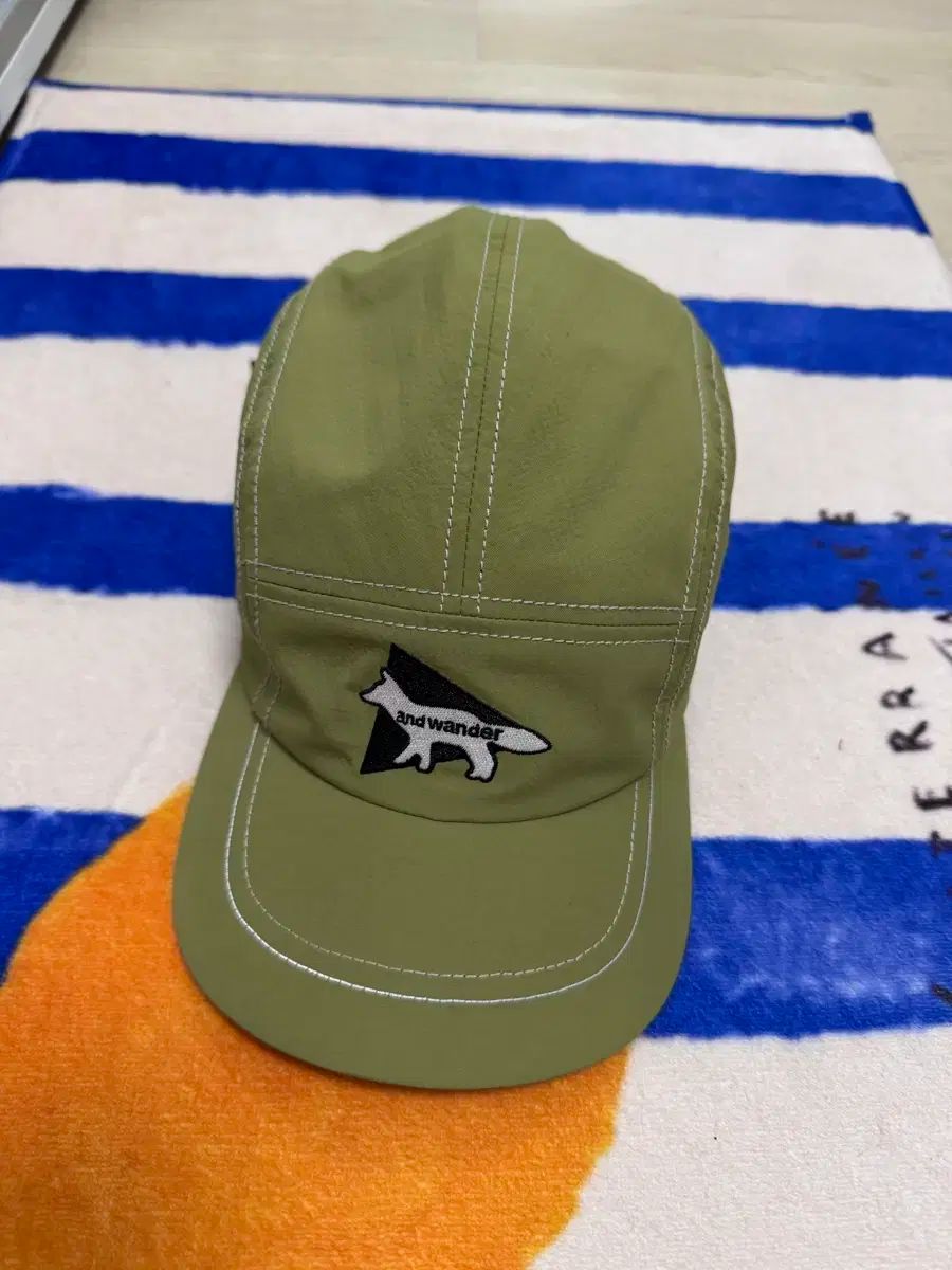 アンドワンダー メゾンキツネ キャップ