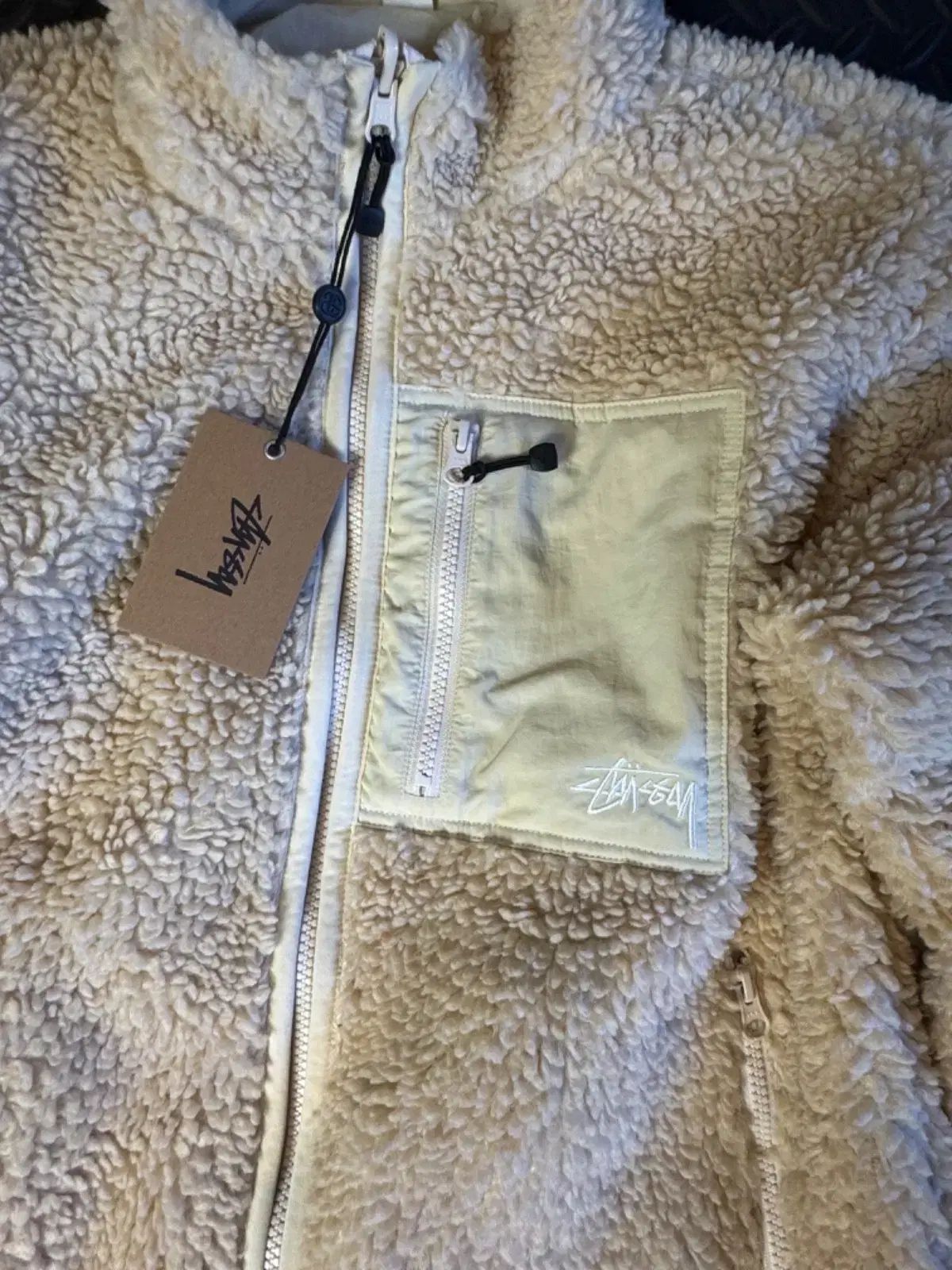 ステューシーのシェルパ リバーシブル ジャケット ナチュラル