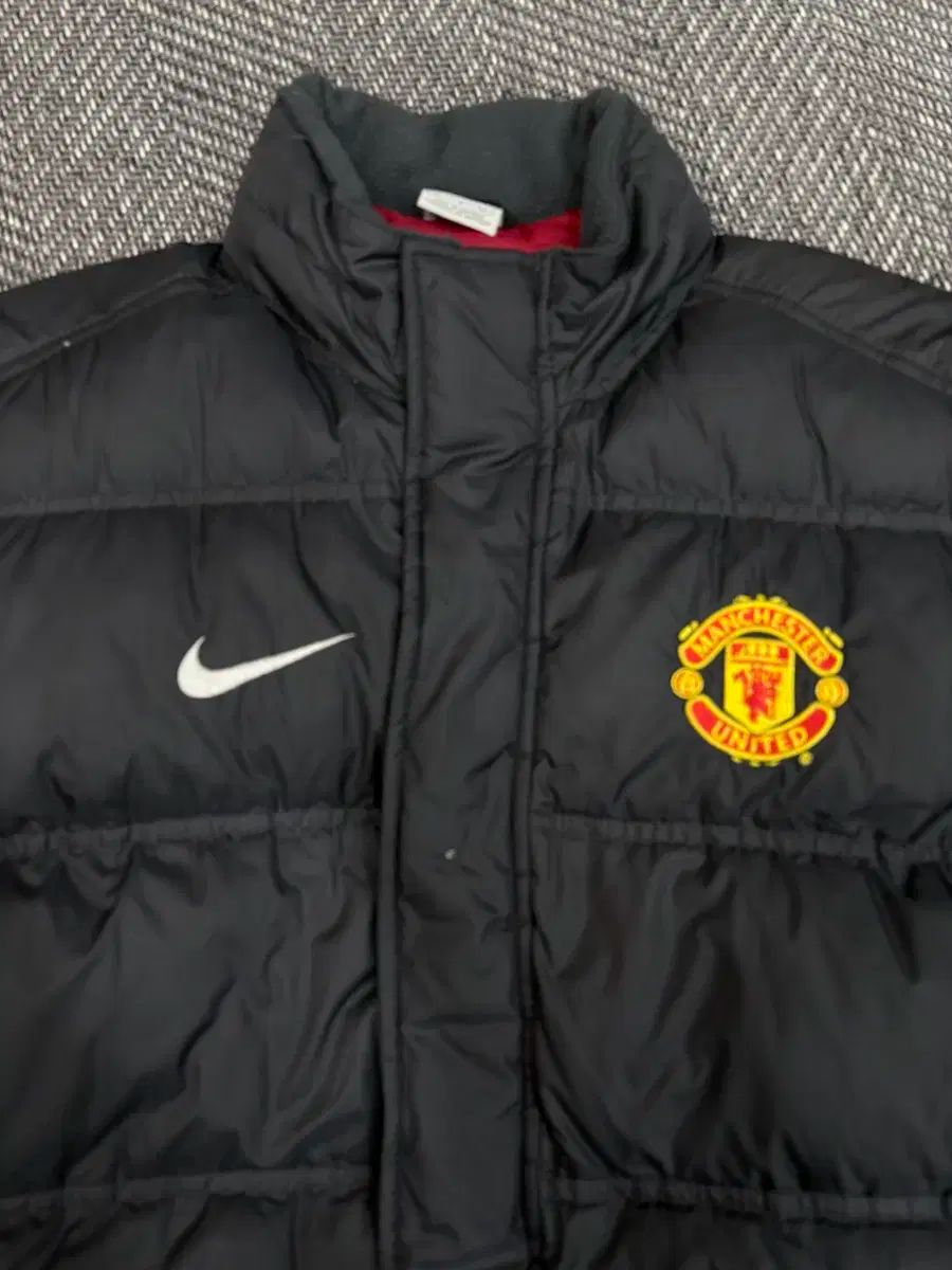 Nike マンチェスター・ユナイテッド ダウンコート　 ブラック 100 NIKE MANCHESTER UNITED FC(マンチェスター・ユナイテッドFC