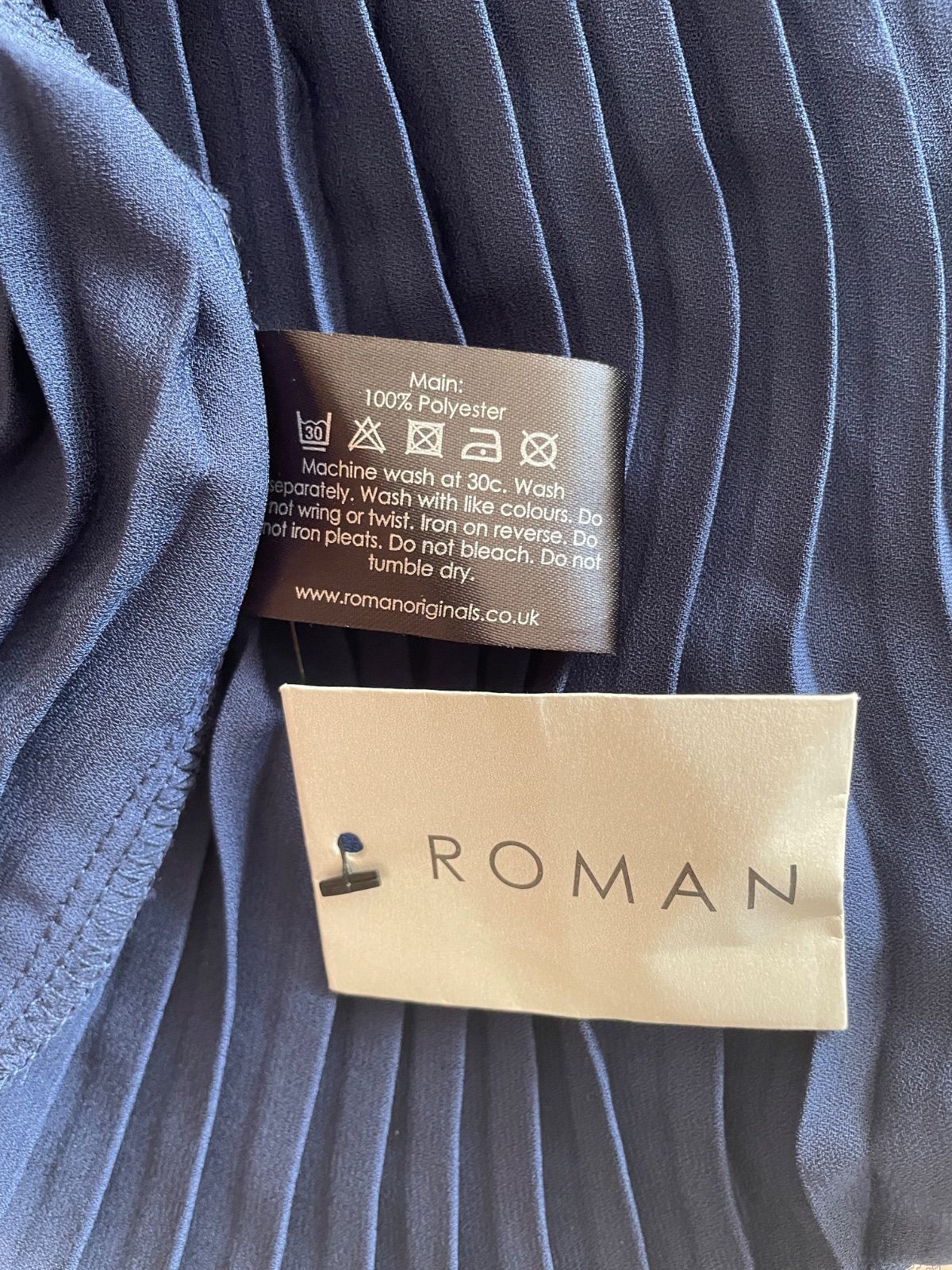 ネイビーVネックボタンお洒落なプリーツフ アシメトリー裾