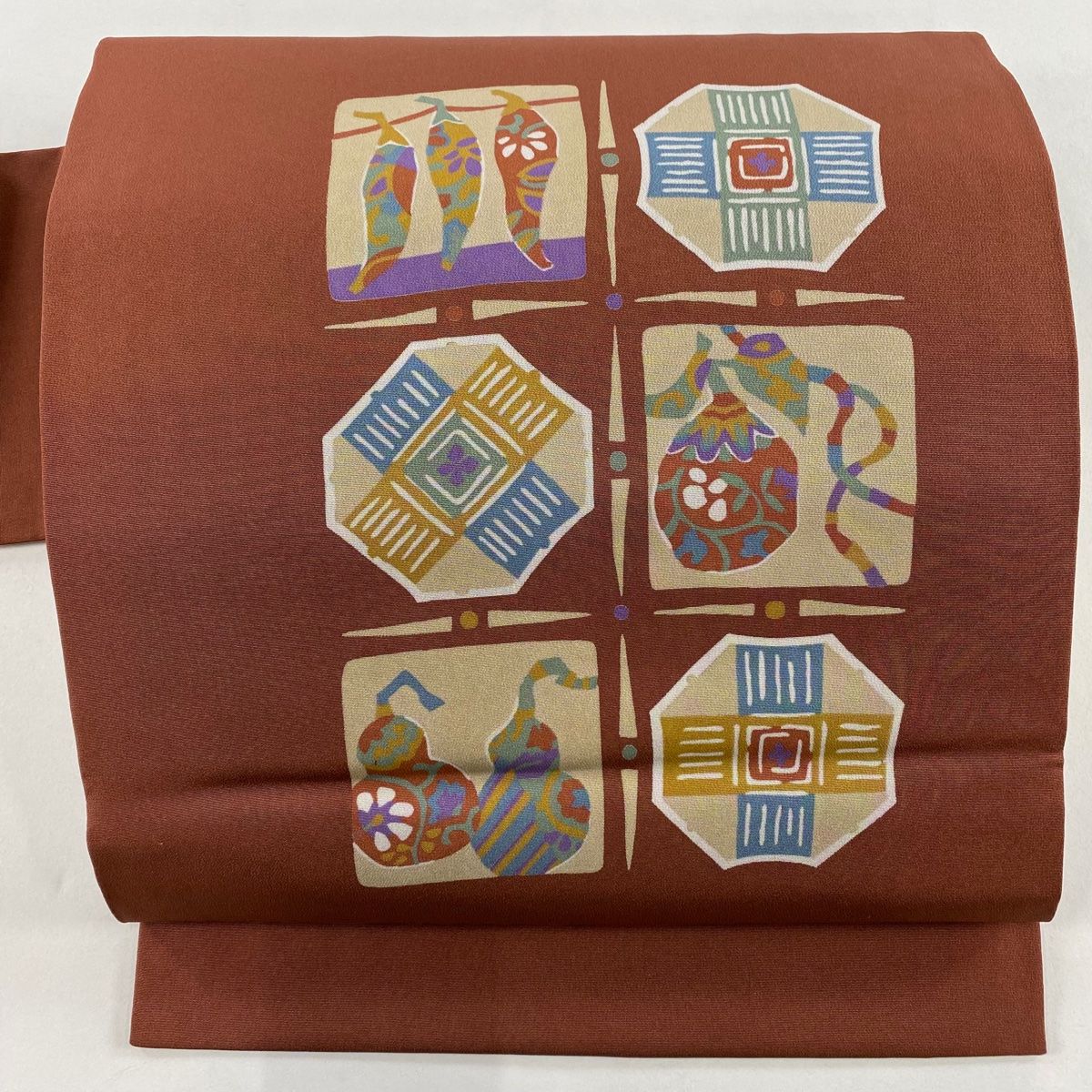 名古屋帯 秀品 生り物 幾何学模様 赤茶 正絹