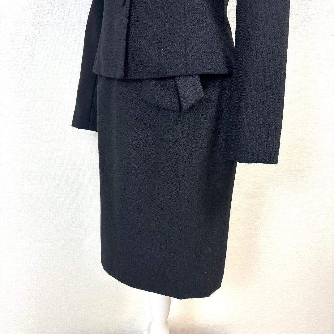  スカートセットアップ 上38下9 黒無地 コサージュ その他 トップス