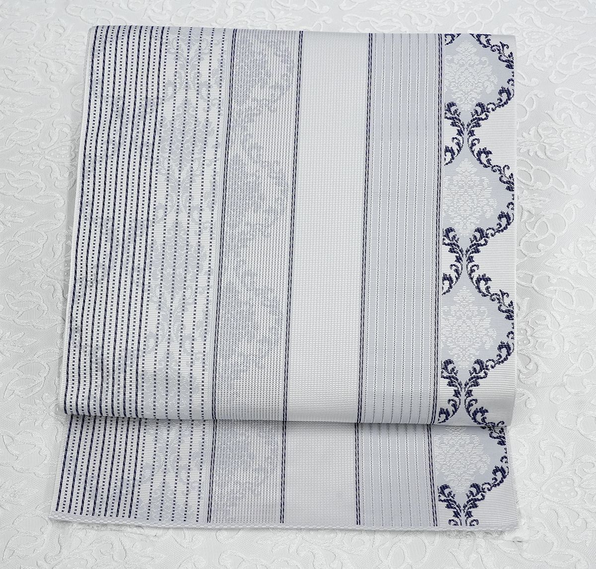 未仕立 博多帯 協和織 八寸名古屋帯 涌唐花文 グレー 仕立代込み