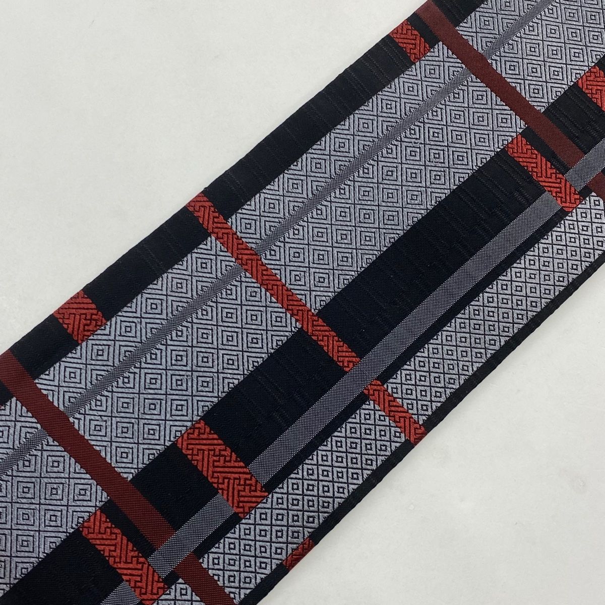  名古屋帯 秀品 入子菱 紗綾形 墨色 正絹 名古屋帯 帯