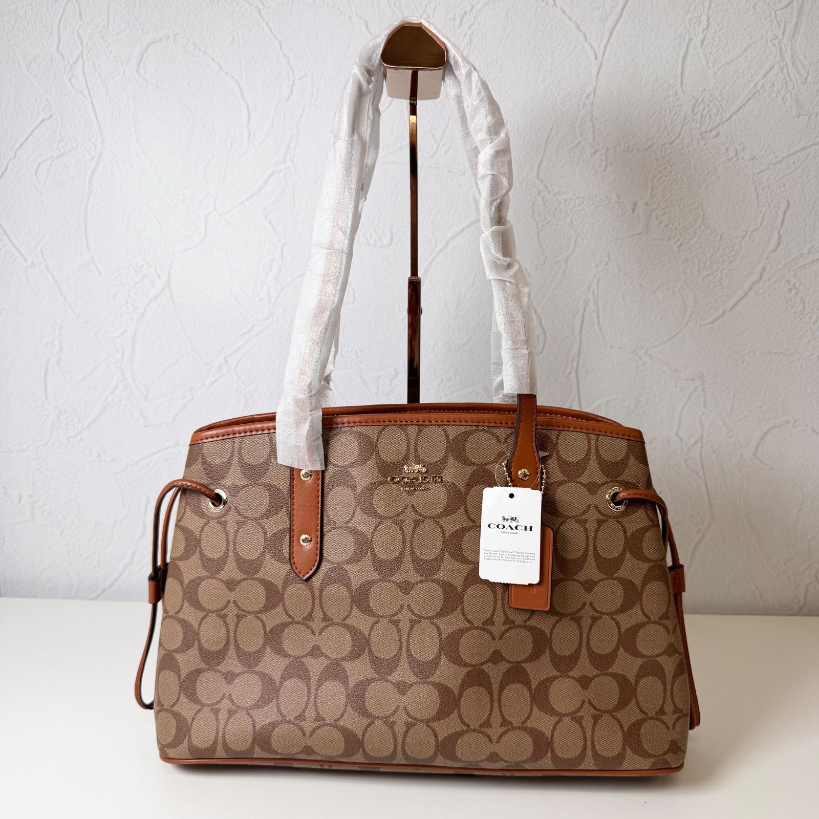 NEWランク COACH トートバッグ bag シグネチャー ドローストリング キャリーオール PVC レザー ブラウン 57842 4EL