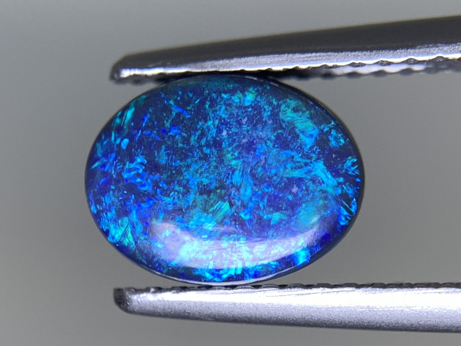 ブラックオパール 天然 1.458ct 中央宝石ソーティング付き 9.0㎜×6.8