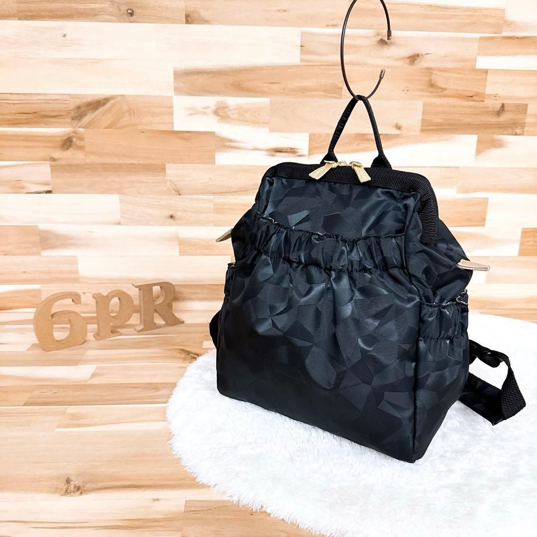 アルティザン-アーティスト ワイド オープン リュック ジャガード 黒×金 自立 バックパック