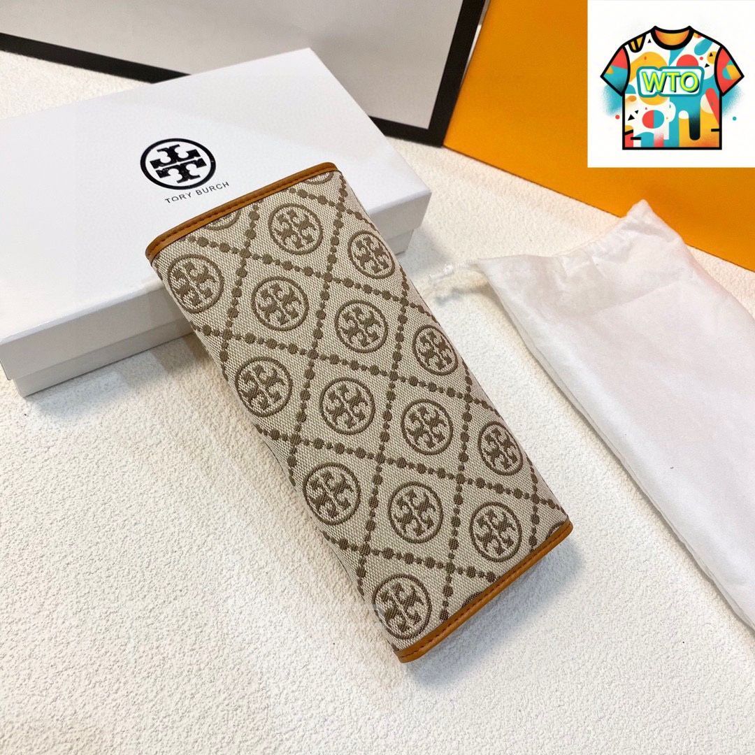 トリーバーチ 布と牛皮の