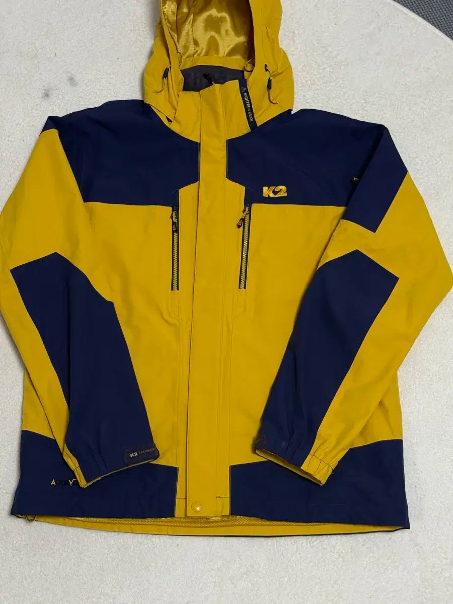 K2 テクニカ アクア 防水 ジャケット イエロー ネイビー 100