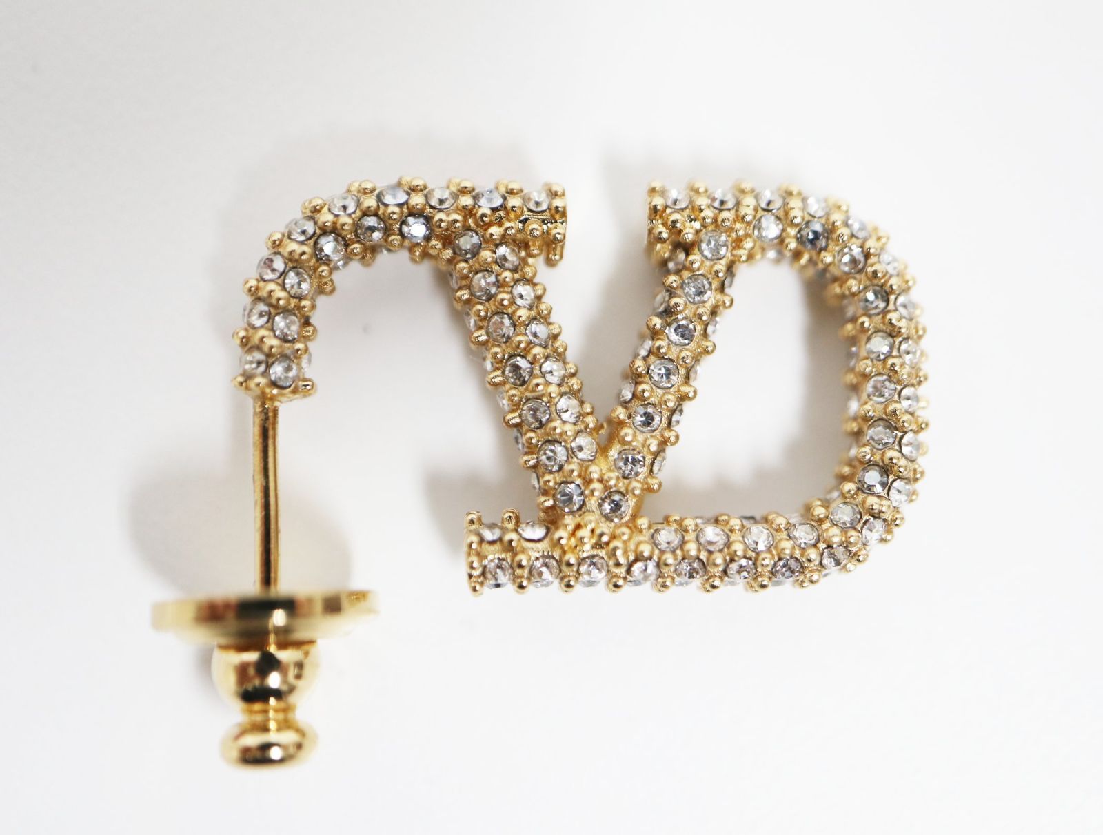 ヴァレンティノガラヴァ―ニ VALENTINO GARAVANI Vロゴメタル クリスタル ピアス ゴールド