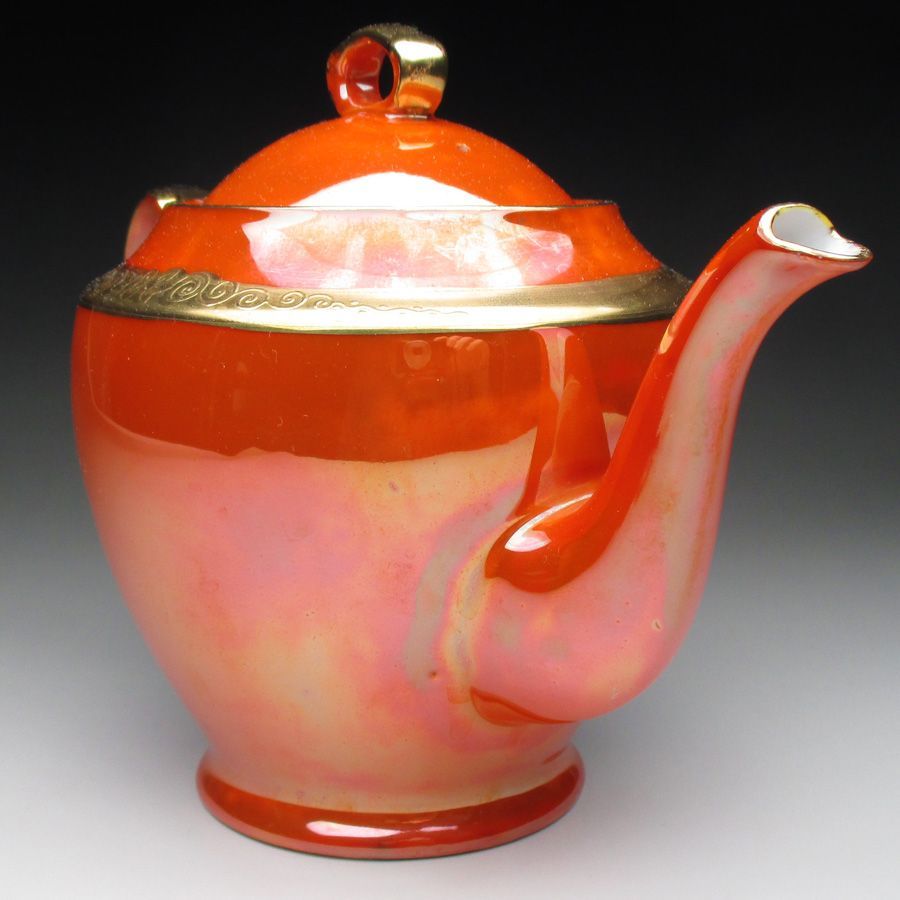 オレンジ色地金盛り