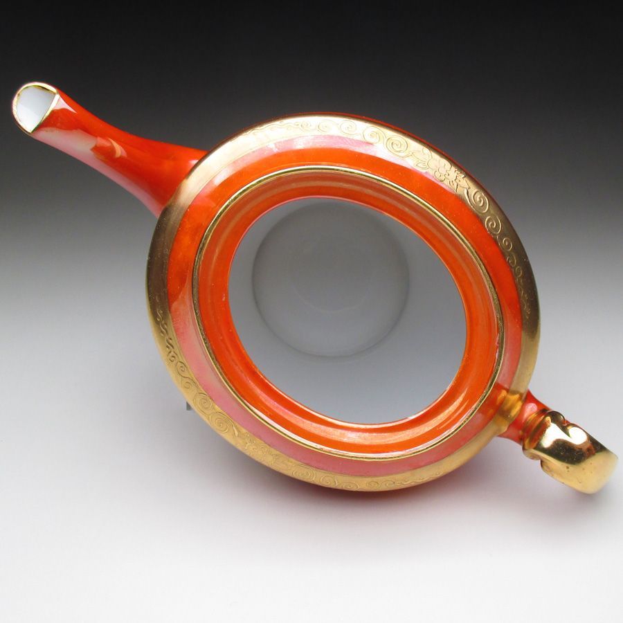 オレンジ色地金盛り