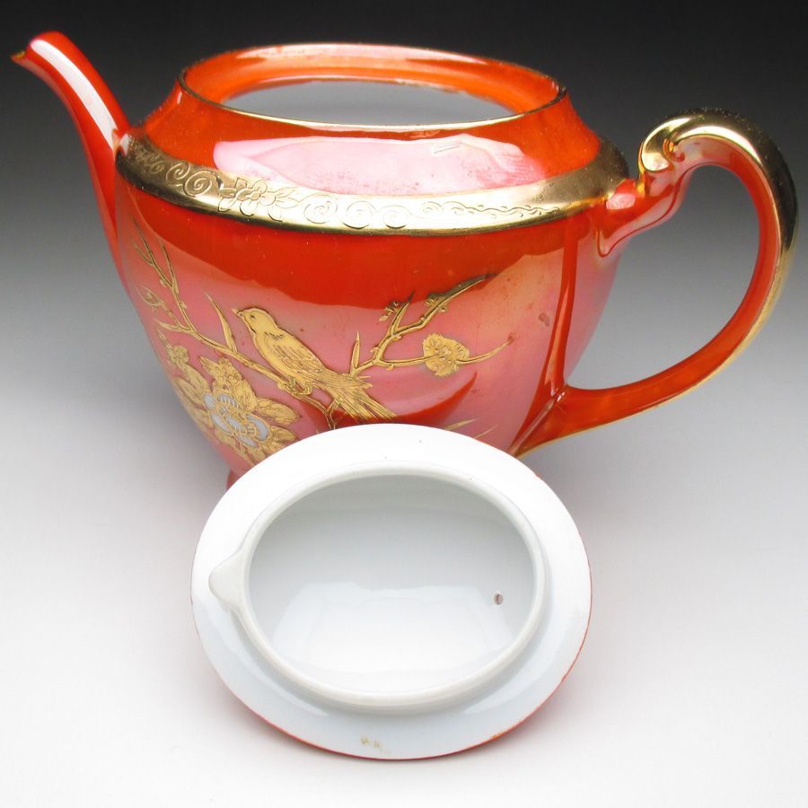 オレンジ色地金盛り