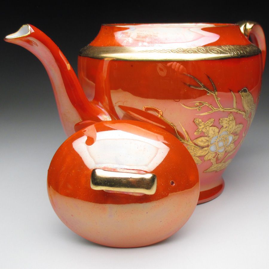 オレンジ色地金盛り