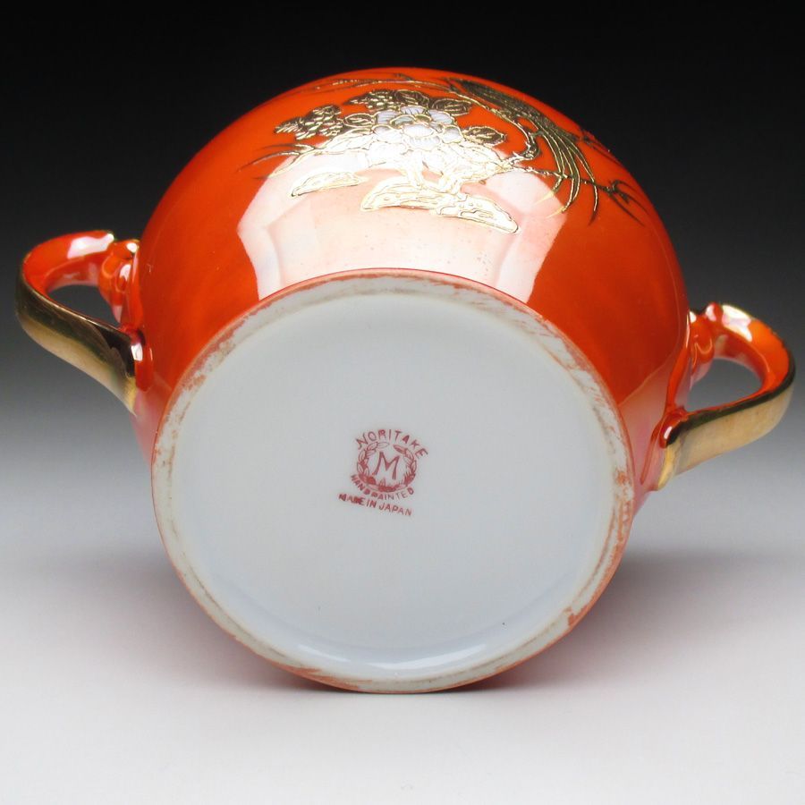 オレンジ色地金盛り