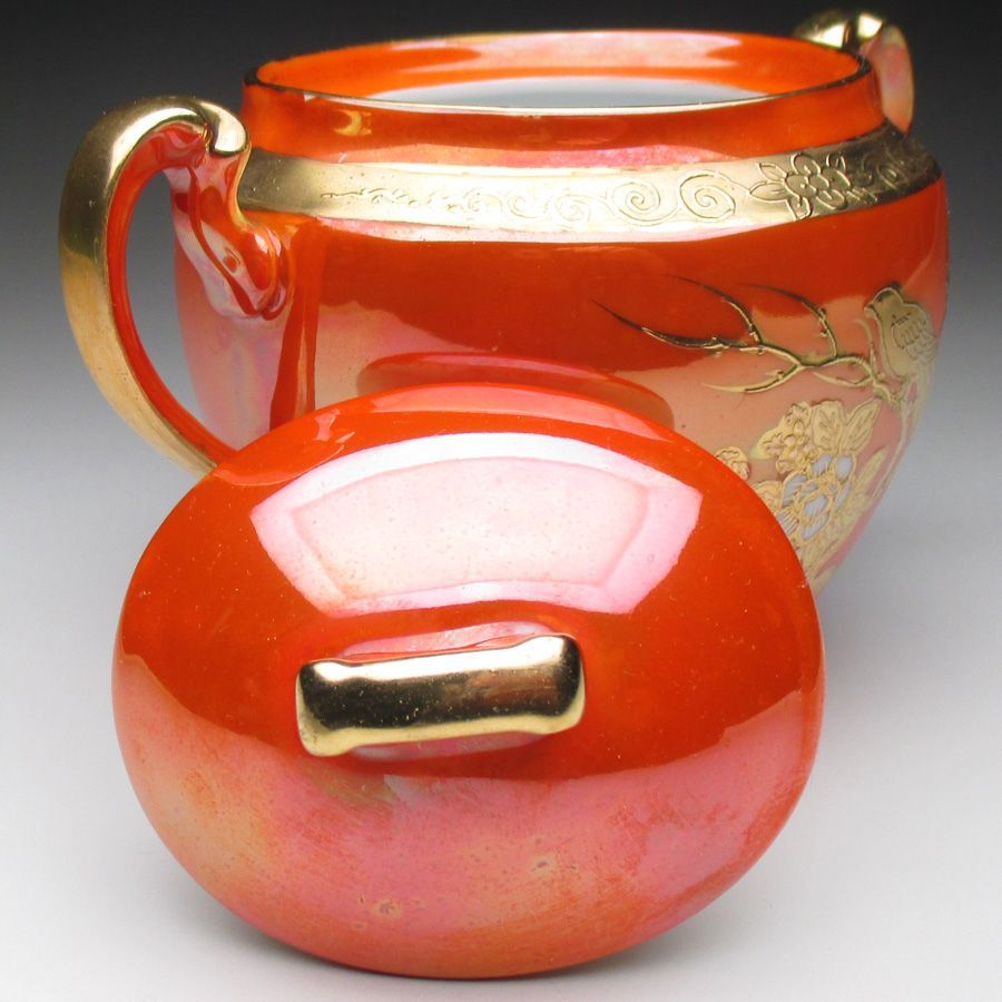 オレンジ色地金盛り