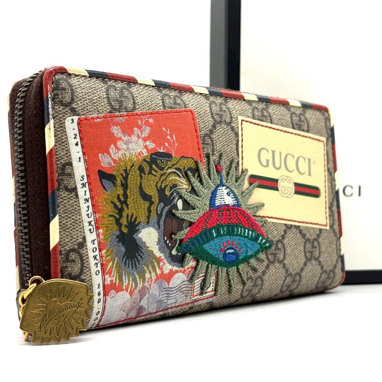 唯一無二のアート性】 GUCCI グッチ 長財布 クーリエ GGスプリーム 虎