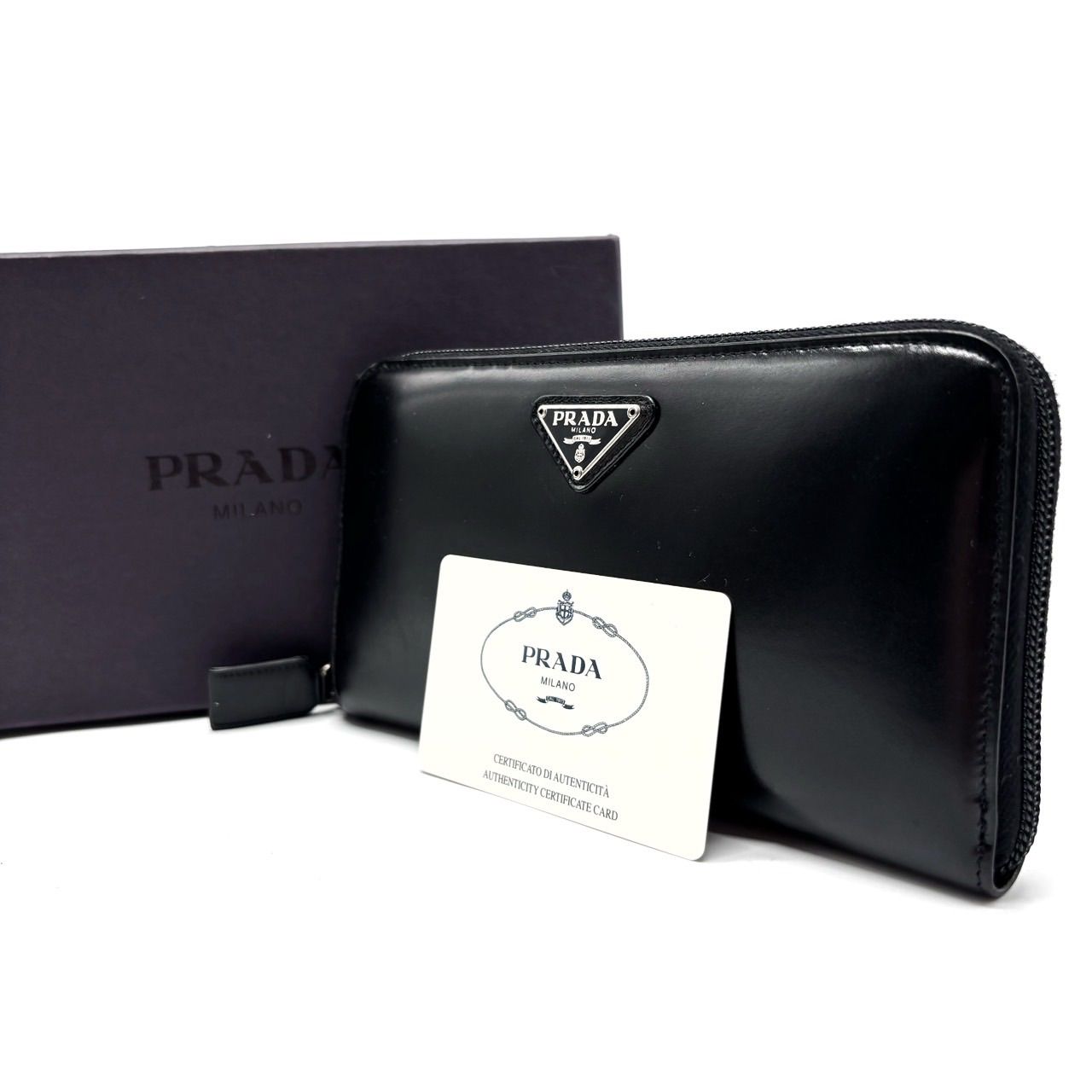 PRADA プラダ 長財布 ロングウォレット ラウンドファスナー 三角プレート レザー 革 ブラック 黒色 ユニセックス 男女兼用 メンズ レディース