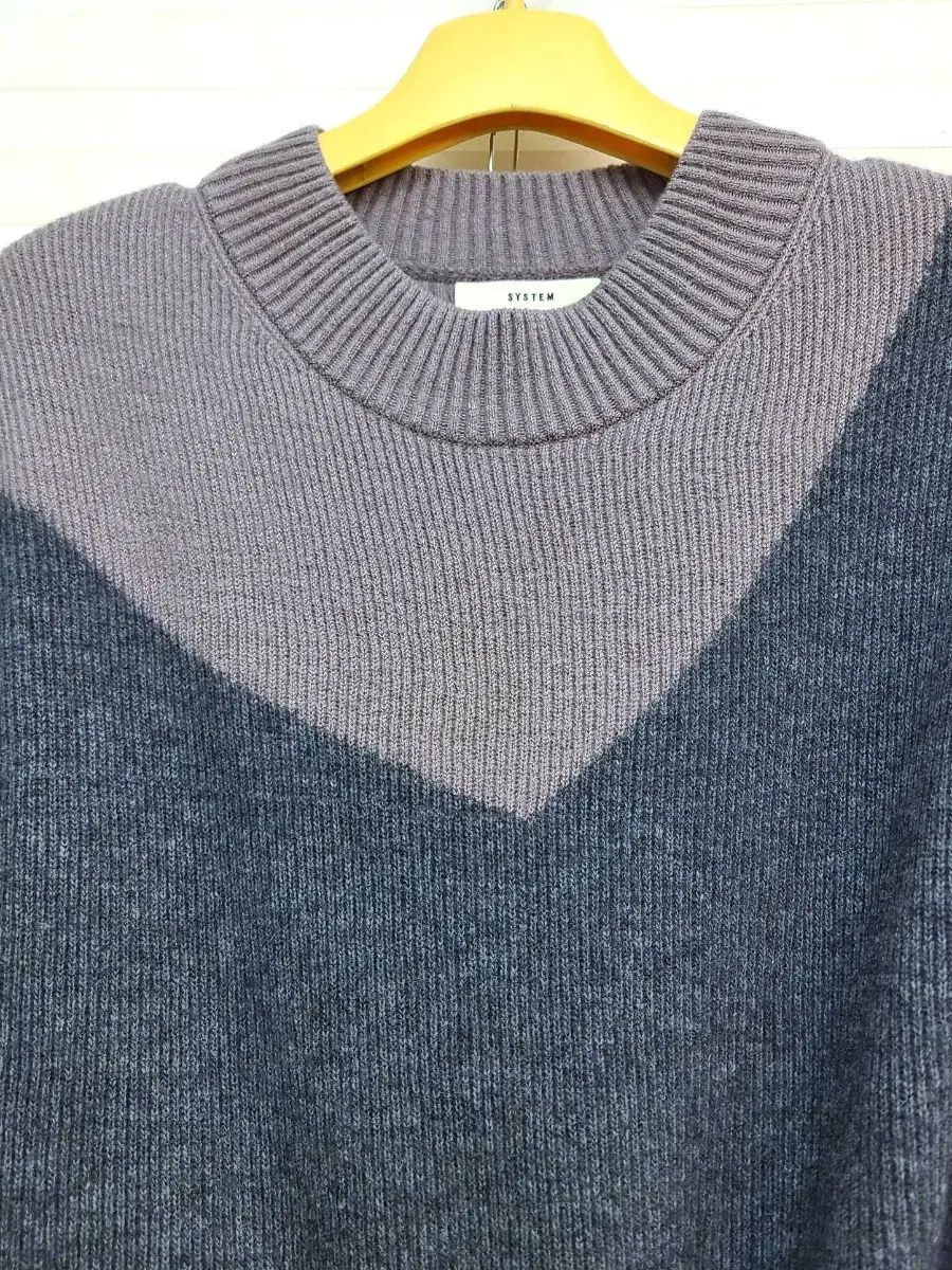 システム ウール100 アシメトリー ニットTシャツ