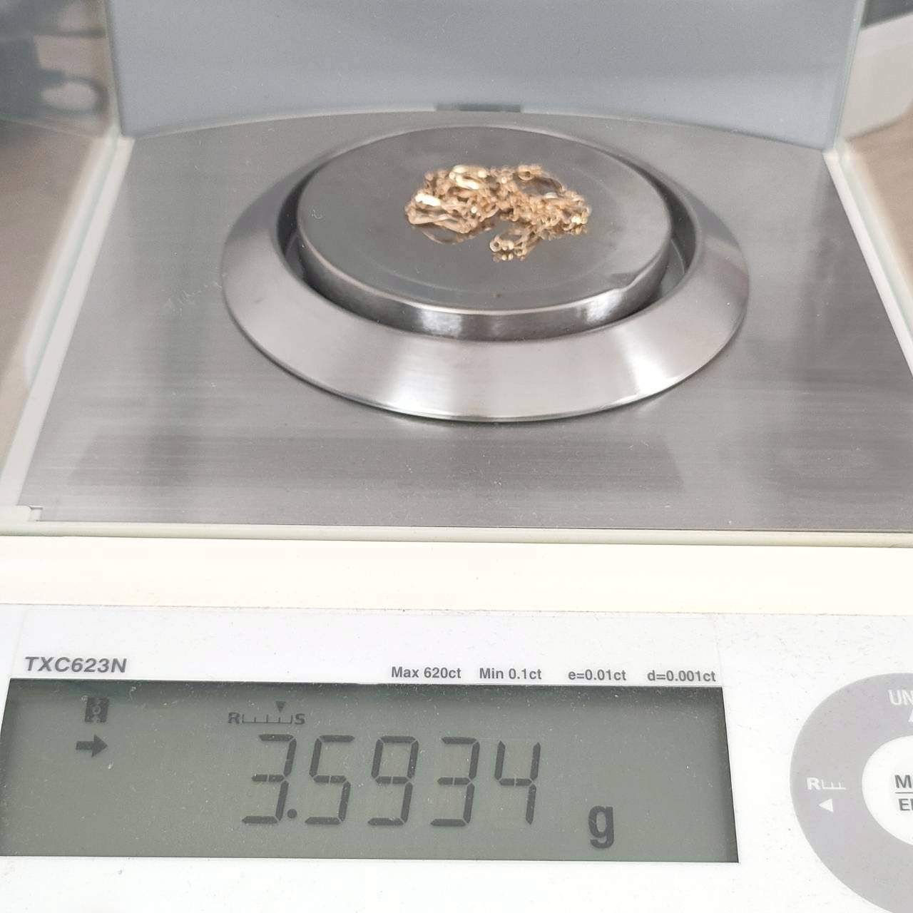 3.59 g