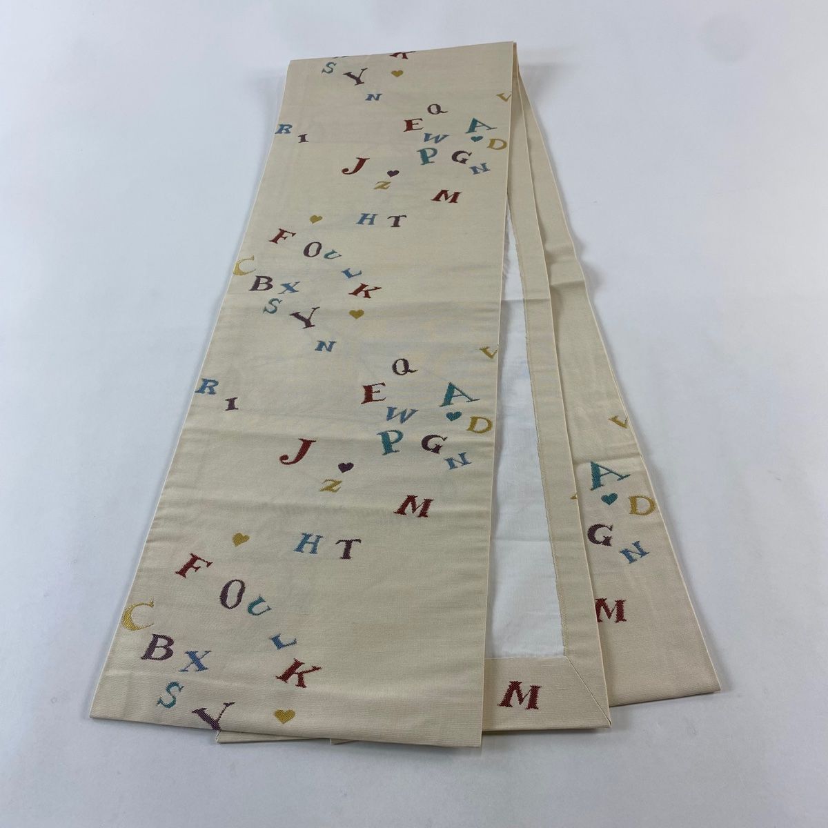  開き名古屋帯 アルファベット クリーム 正絹 名古屋帯 帯