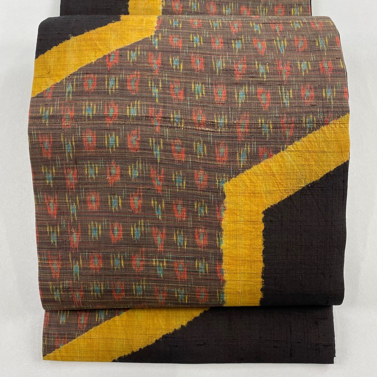 開き名古屋帯 秀品 幾何学 焦茶色 正絹