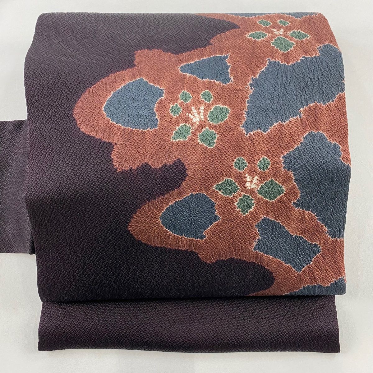 名古屋帯 秀品 幾何学 花 縮緬 茶紫 正絹