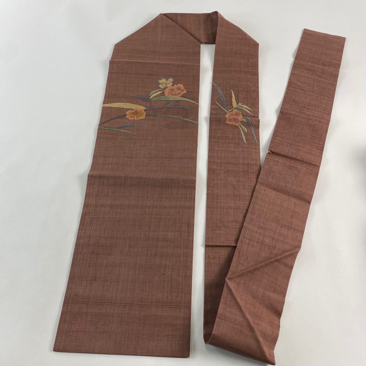  名古屋帯 秀品 紬地 椿 ヱ霞 刺繍 小豆色 正絹 名古屋帯 帯