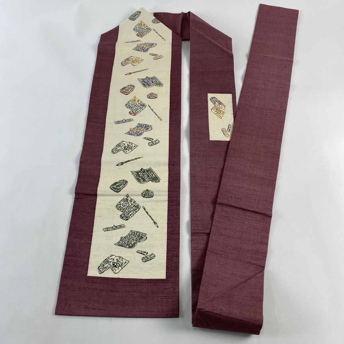  名古屋帯 秀品 紬地 冊子 筆 小豆色 正絹 名古屋帯 帯