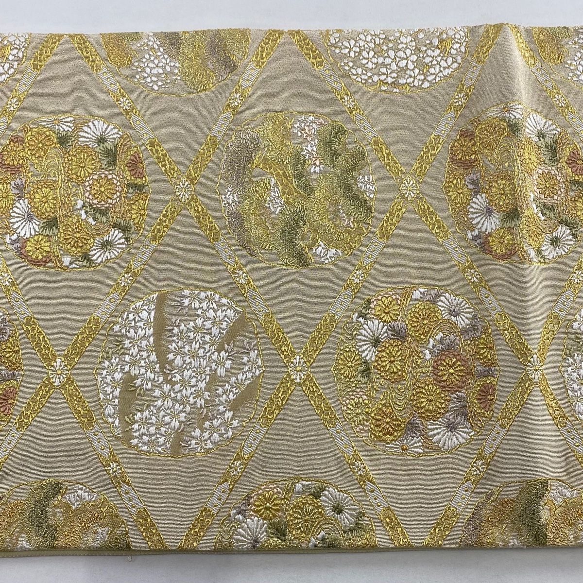 袋帯 菱雪輪小花文