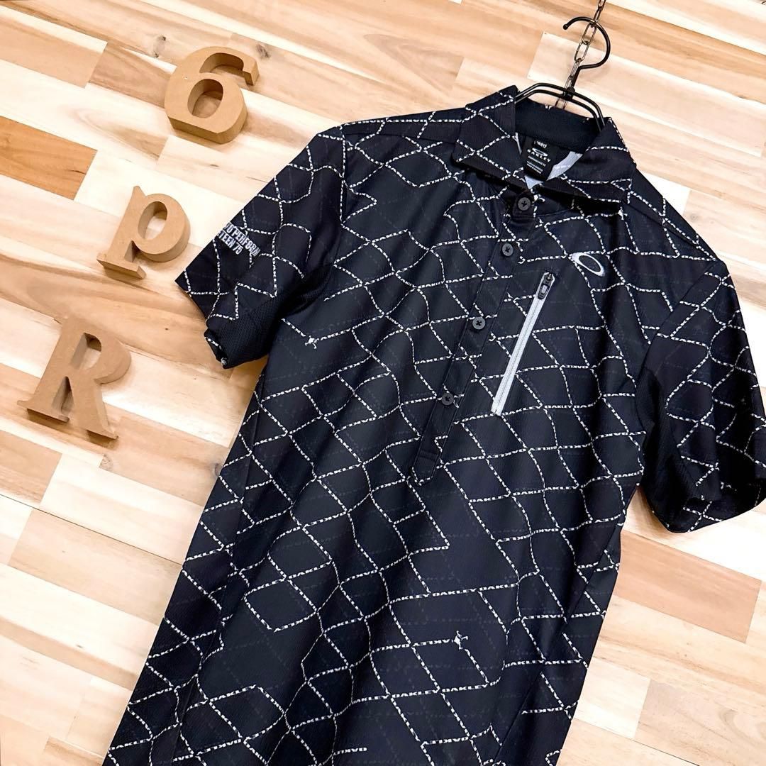 オークリー ゴルフ スカル ロゴ 半袖ポロシャツ 総柄 M 黒×白